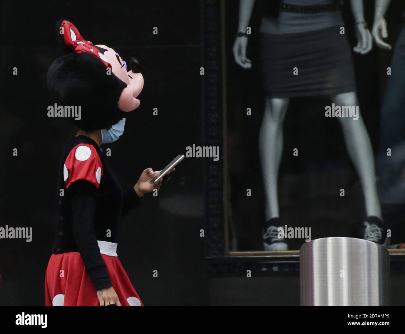 New York, USA. 21st Oct 2020. New York, United States. 21st Oct, 2020. A worker dressed as Minnie Mouse wears face masks to protect from and to prevent the spread of COVID-19 in Times Square in New York City on Wednesday, October 21, 2020. Recently, a few neighborhoods in Brooklyn and Queens have seen a slight uptick in coronavirus cases. Photo by John Angelillo/UPI Credit: UPI/Alamy Live News Credit: UPI/Alamy Live News Stock Photo