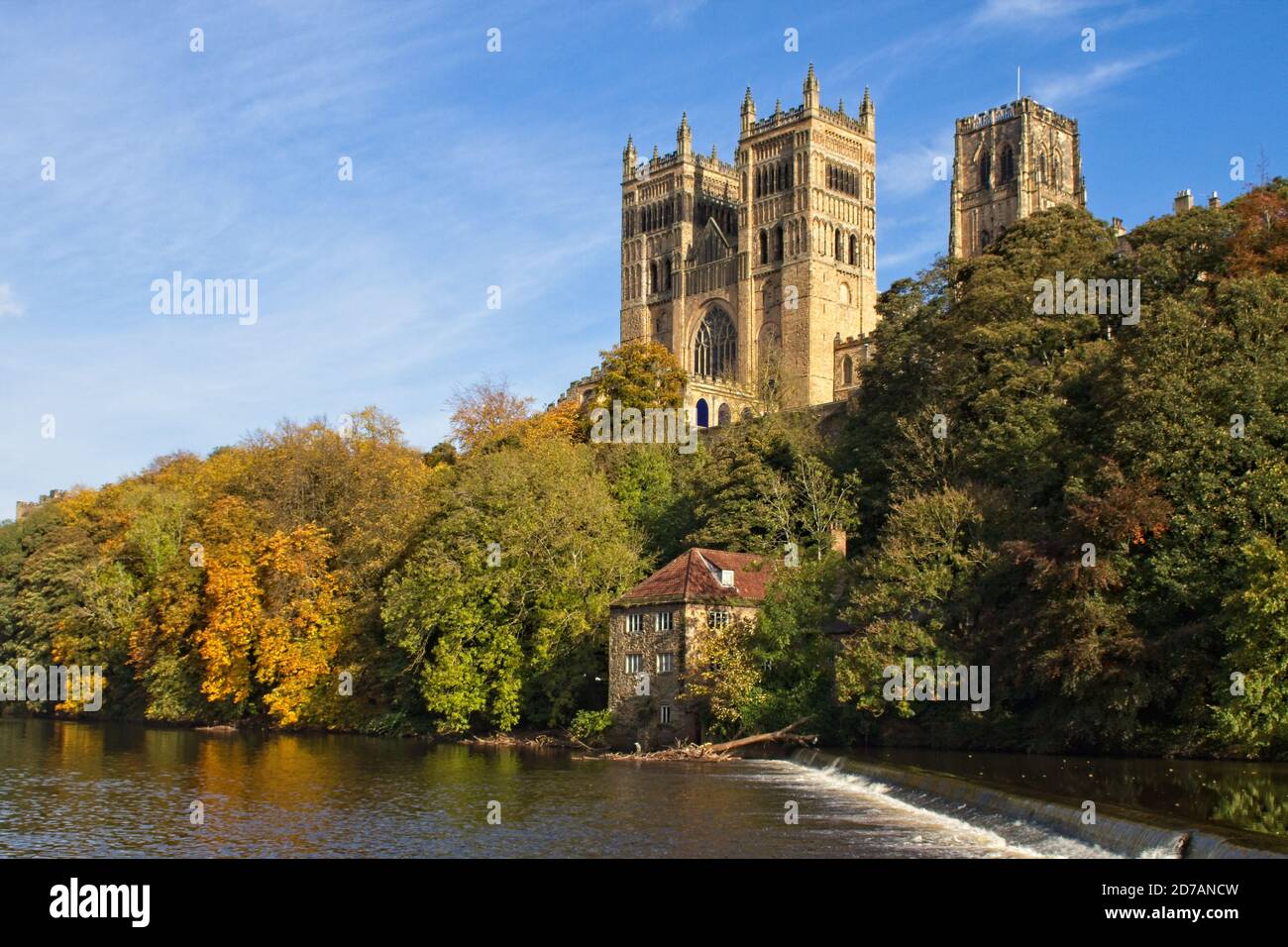 The landmark Durham Cathedral stands high above the River Wear in the city of Durham in the north east of England. Captured in autumn. Stock Photo