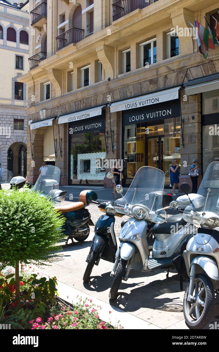 Louis Vuitton store in Padua, Italy. Scooters parked in front of store Stock Photo Alamy