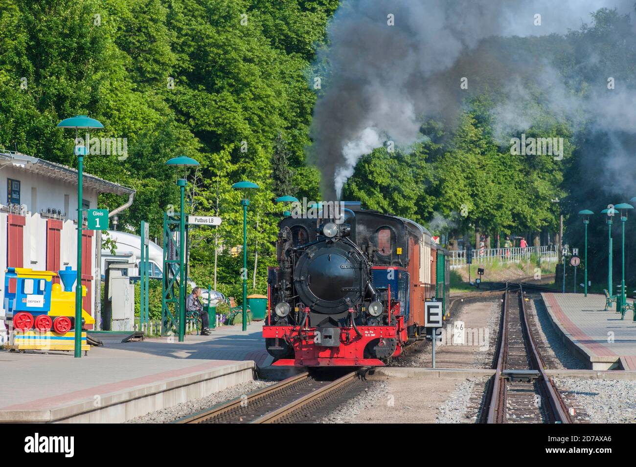 GERMANY, ISLAND RUEGEN, BINZ, 2011-06-05: Historical narrow gauge steam train 'Rasender Roland' (racing roland) leaving the station of Binz on an sunn Stock Photo