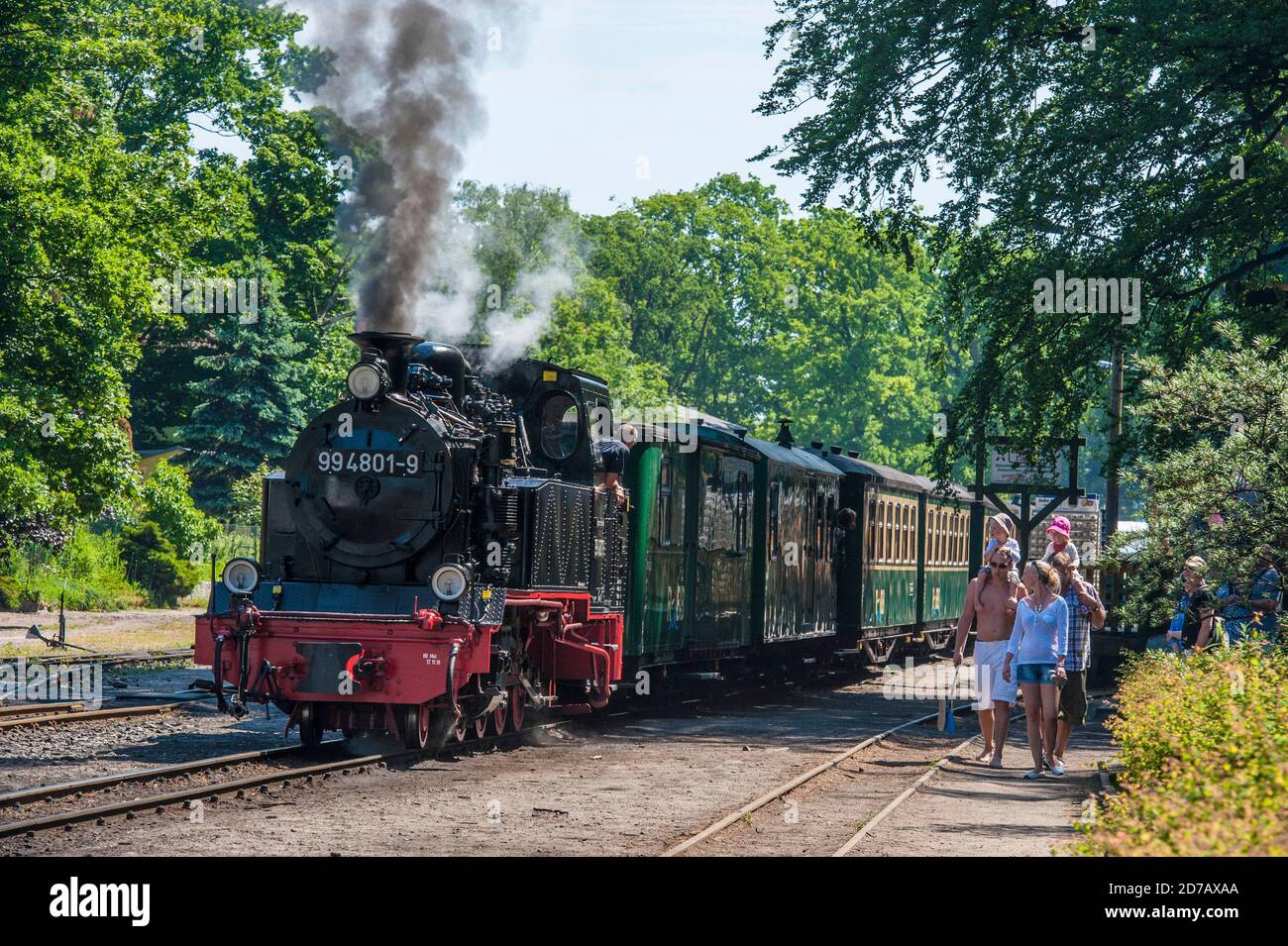 GERMANY, ISLAND RUEGEN, PUTBUS, 2011-06-05: Historical narrow gauge steam train 'Rasender Roland' (racing roland) leaving the station of Putbus on an Stock Photo