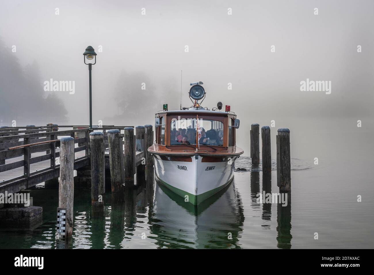 GERMANY, Berchtesgaden, Königssee, excursion boat with electric engine, ready to leave the jetty during a hazy early morning Stock Photo