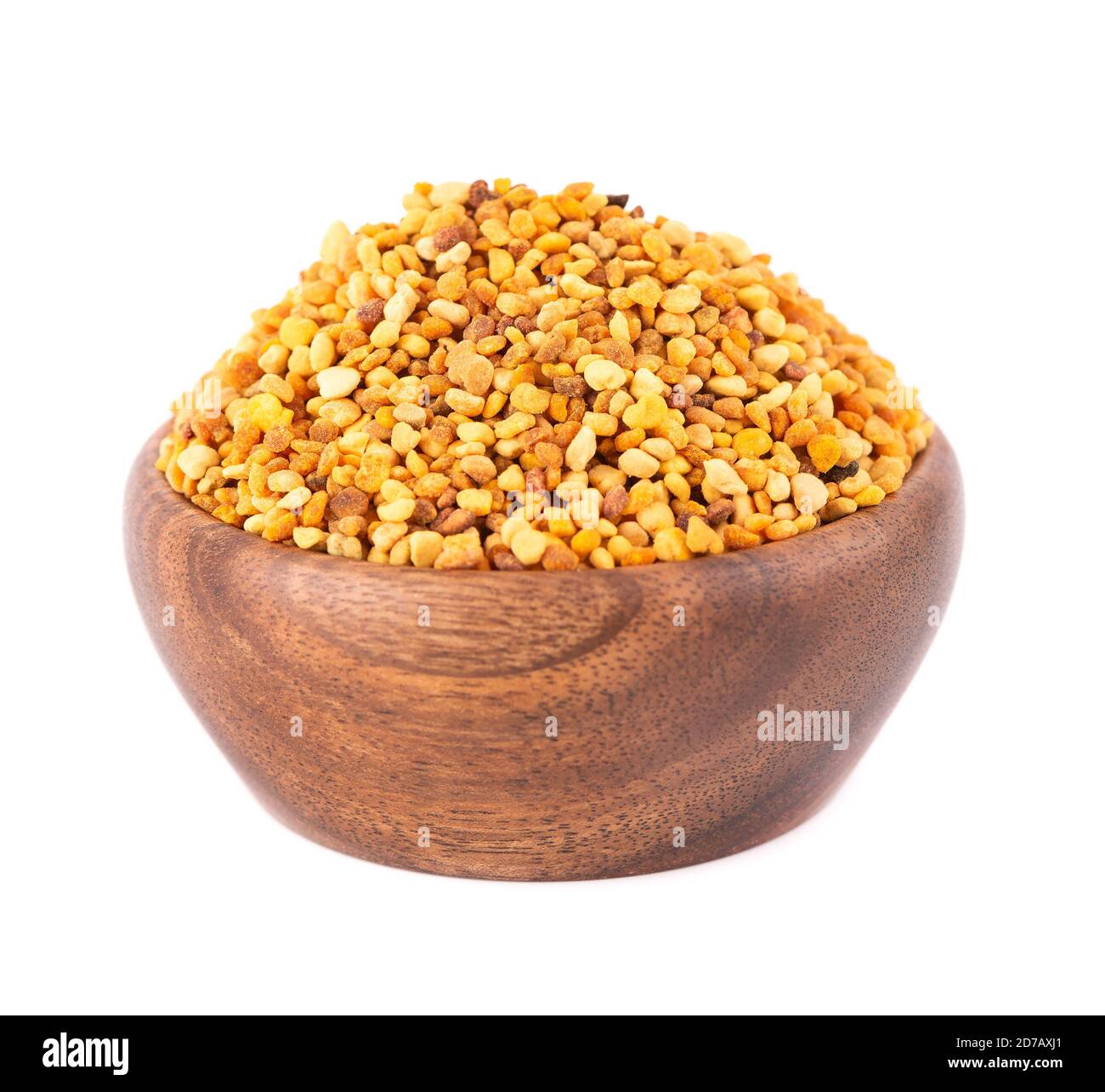 Flower pollen grains in wooden bowl, isolated on white background. Pile of bee pollen or perga. Stock Photo