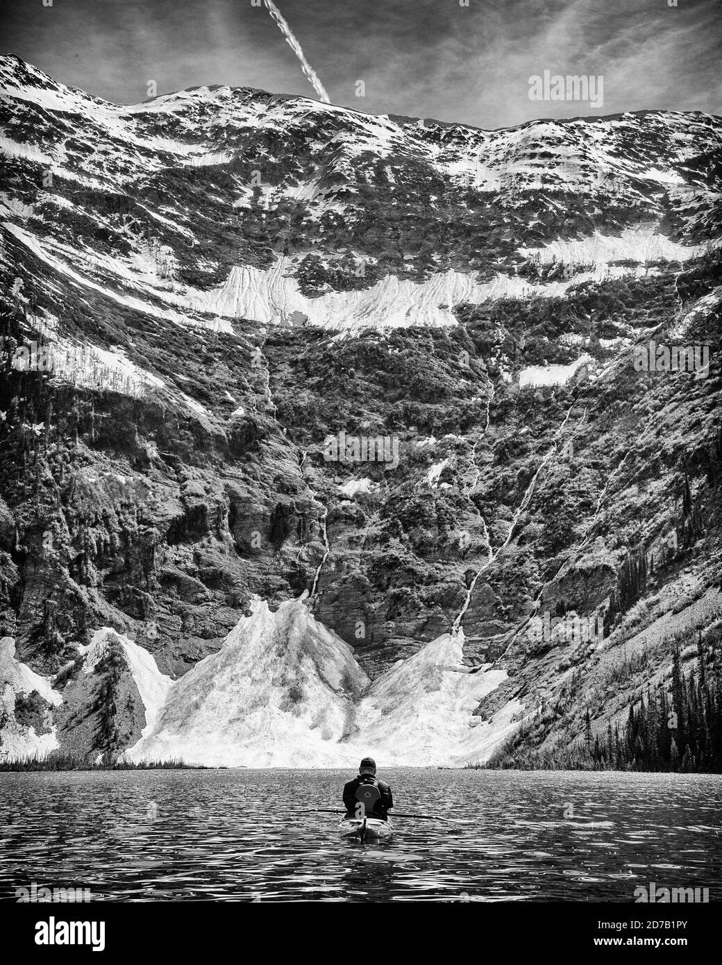 Rear View of Man Kayaking, White Boar Lake, British Columbia, Canada Stock Photo