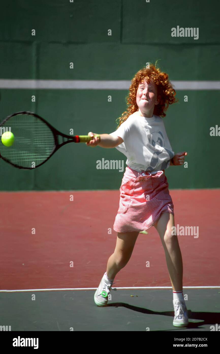 11 year old female competes in a tennis tournament Stock Photo