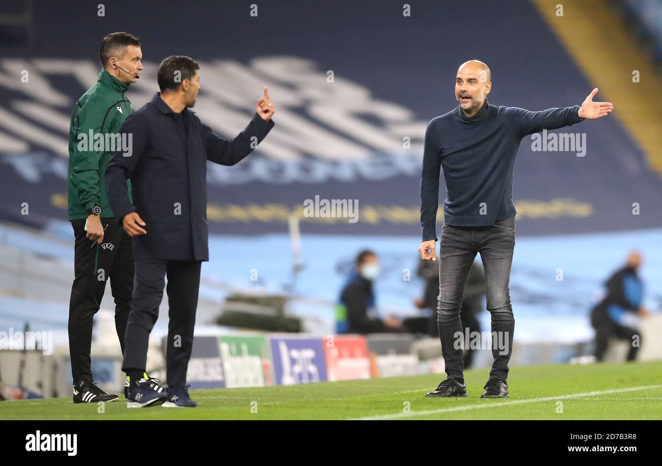 Manchester City manager Pep Guardiola (right) gestures towards FC Porto  manager Sergio Conceicao on the touchline during the UEFA Champions League  Group C match at the Etihad Stadium, Manchester Stock Photo -