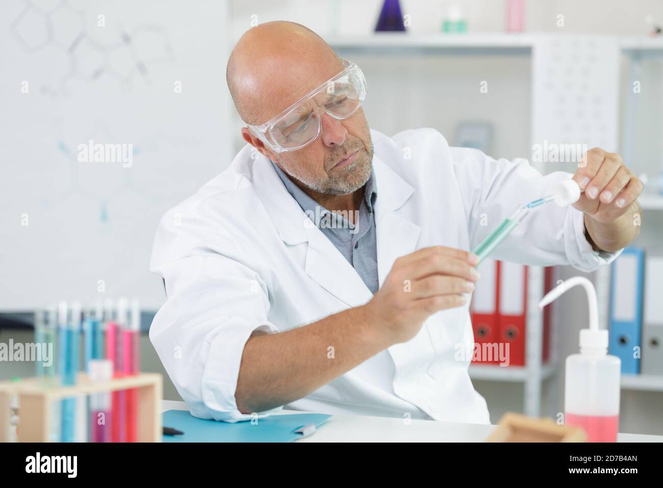 male doctor analyzing tests tubes samples Stock Photo - Alamy