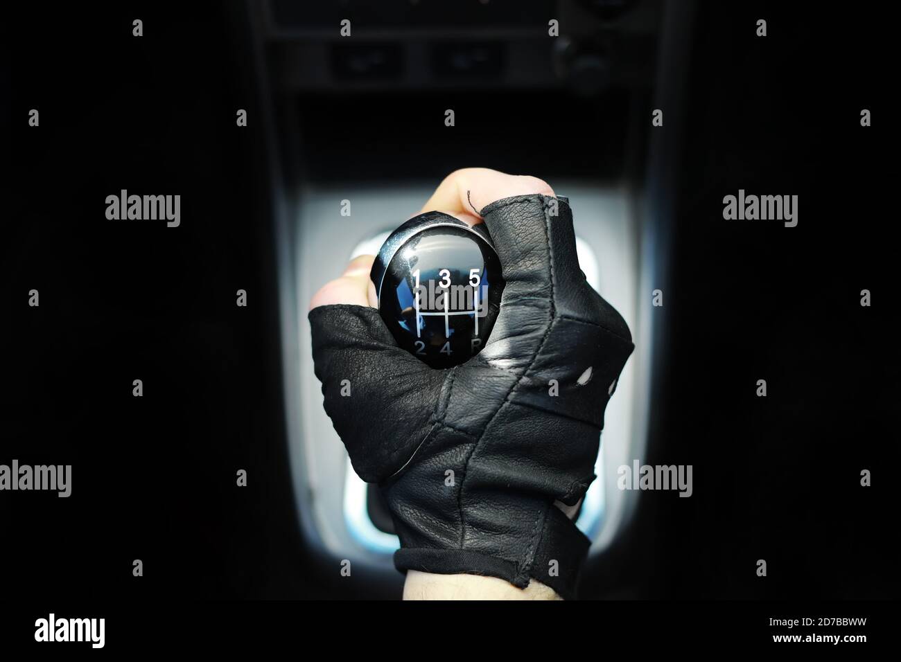 Gear lever. Manual Transmission. Hand on the gear shift in a car Stock