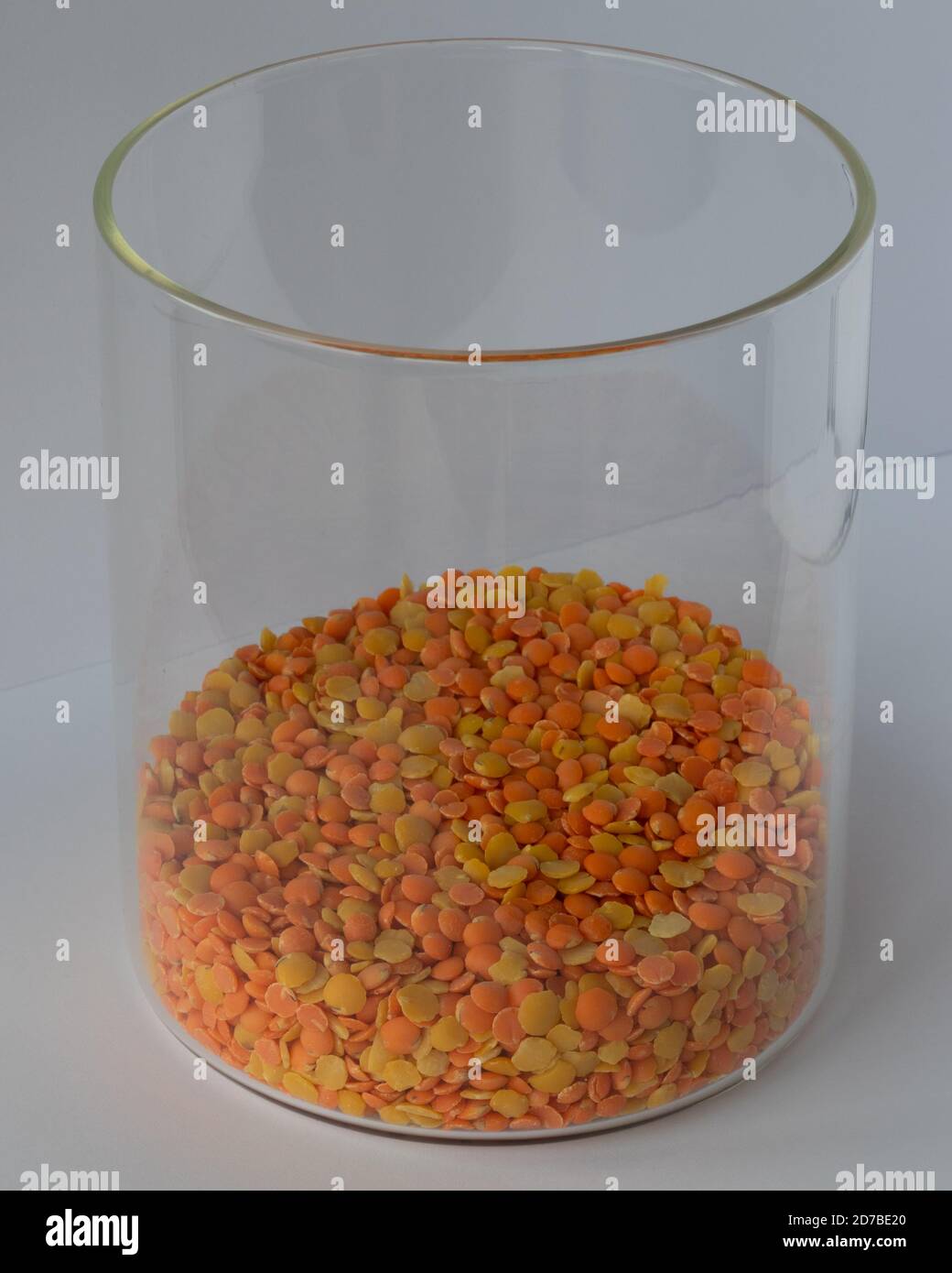 Glass pot  full of red and yellow lentils Stock Photo