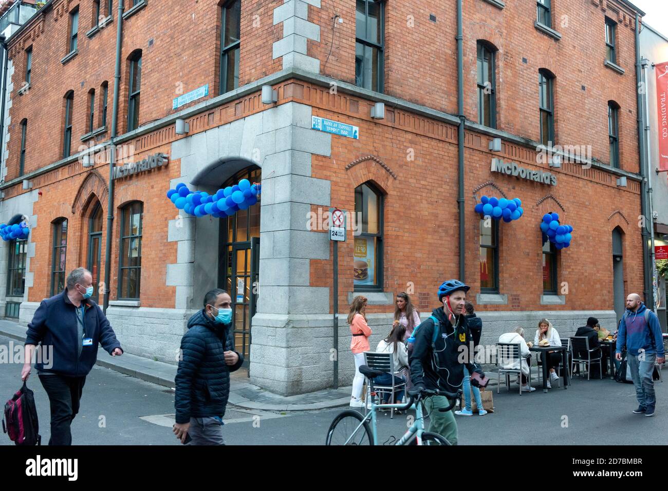 Covid Ireland lockdown and people wearing masks outside McDonald's in Temple Bar Street Dublin during the pandemic outbreak of Coronavirus Covid 19 in Dublin Ireland Stock Photo