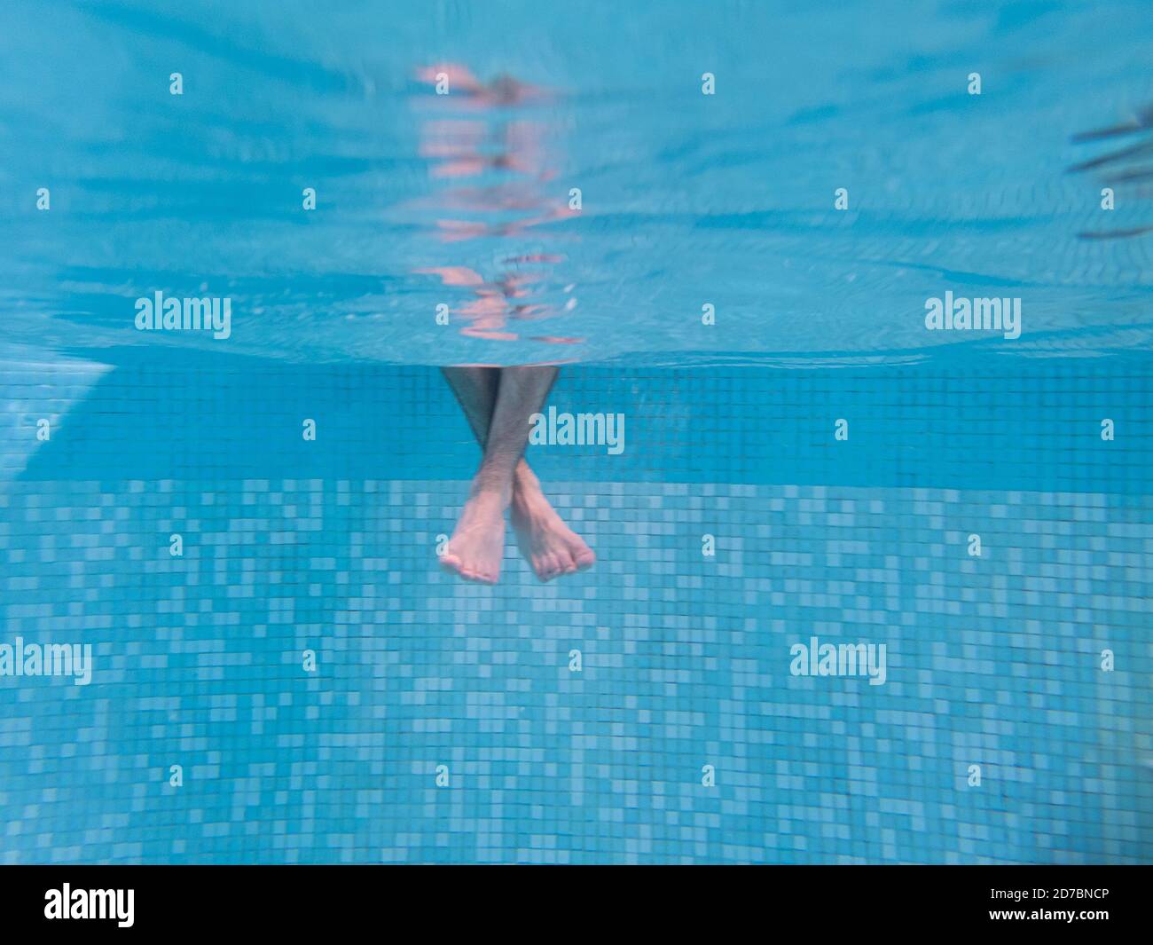 one-person-s-feet-underwater-in-a-blue-pool-stock-photo-alamy