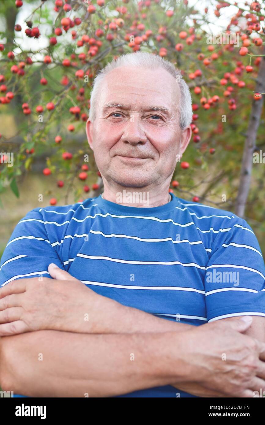 Portrait of a handsome senior man having a rest on a sunny summer day. Healthcare, resort. Happy retirement. Stock Photo