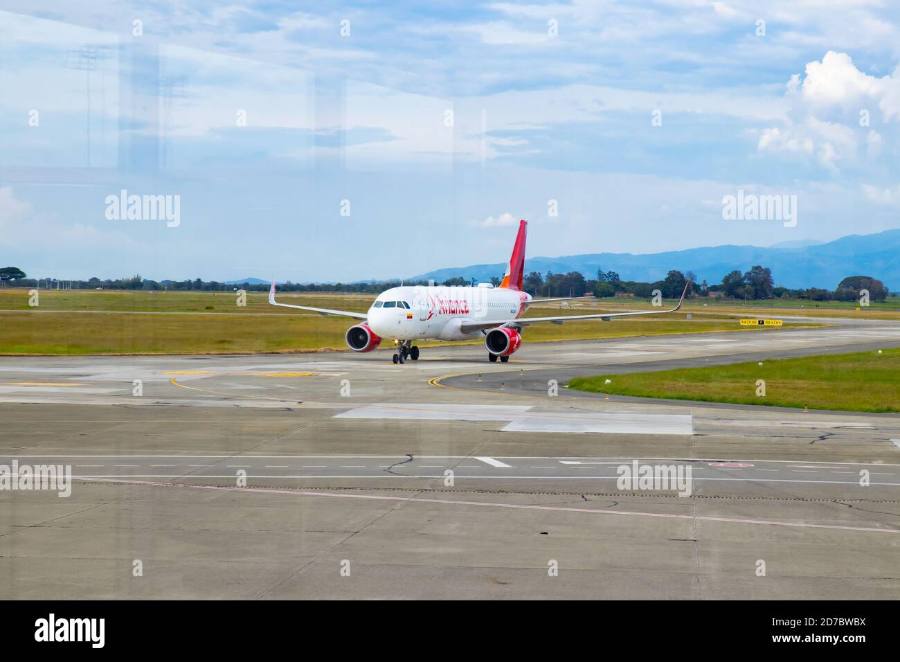 PALMIRA, COLOMBIA - OCTOBER, 2020:  Plane of the Avianca airline landing at  the Alfonso Bonilla Aragon airport near to Cali city in Colombia Stock Photo