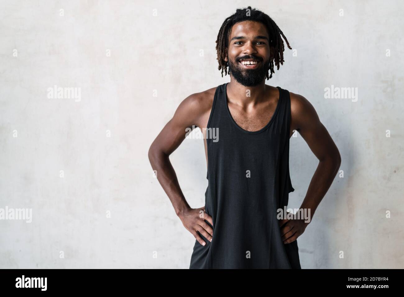 Happy african sportsman stretching hi-res stock photography and images ...