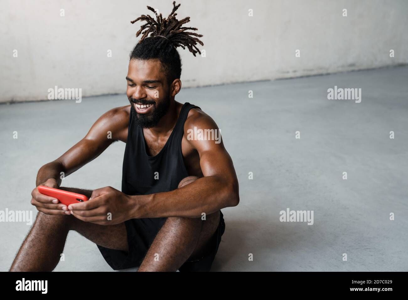 Smiling african american sportsman using hi-res stock photography and ...