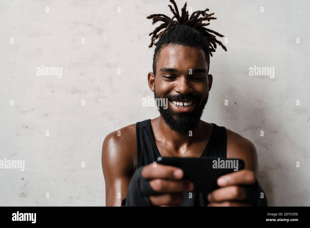 Smiling african american sportsman using hi-res stock photography and ...