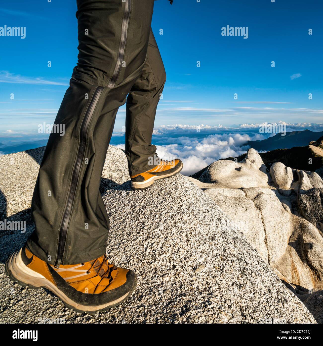 Epic adventure of hiker do trekking activity in mountain of Northern Japan Alps, Nagano, Japan, with panoramic nature mountain range landscape Stock Photo