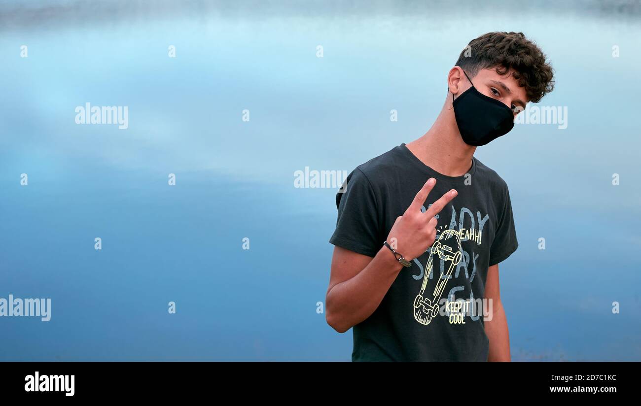 Young black person wearing coronavirus hi-res stock photography and ...