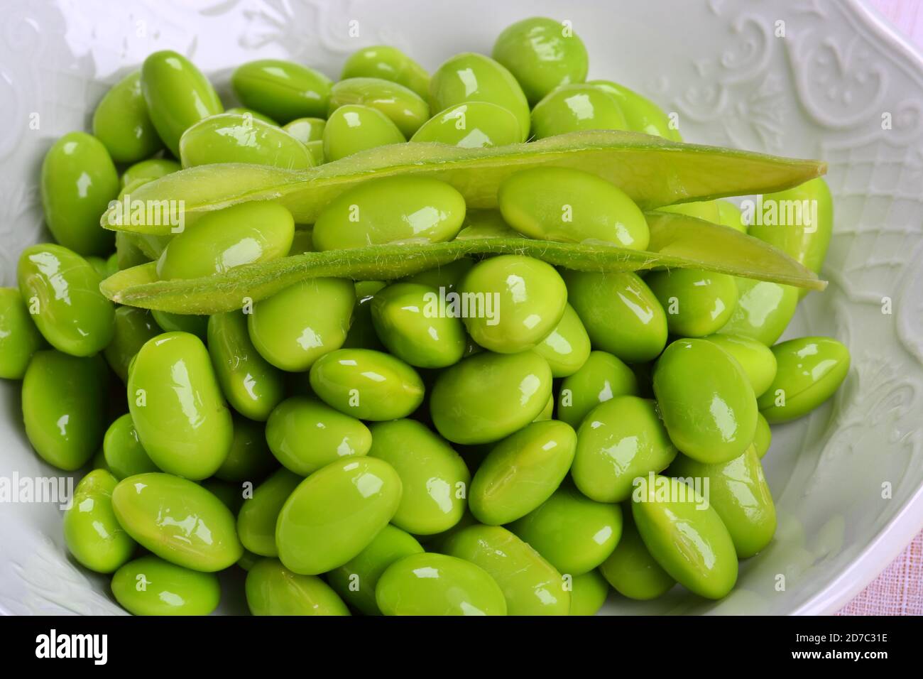 Fresh Green Peas in a White Bowl Stock Photo