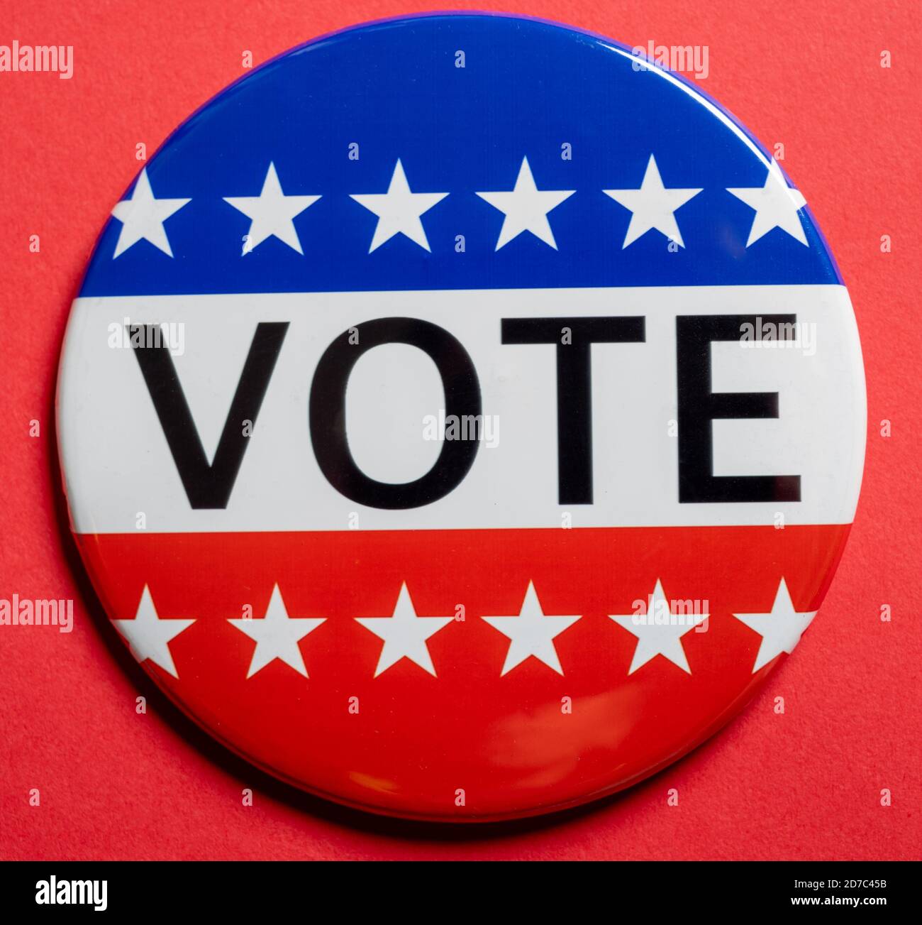 Vote buttons on red background with copy space. Election theme Stock Photo