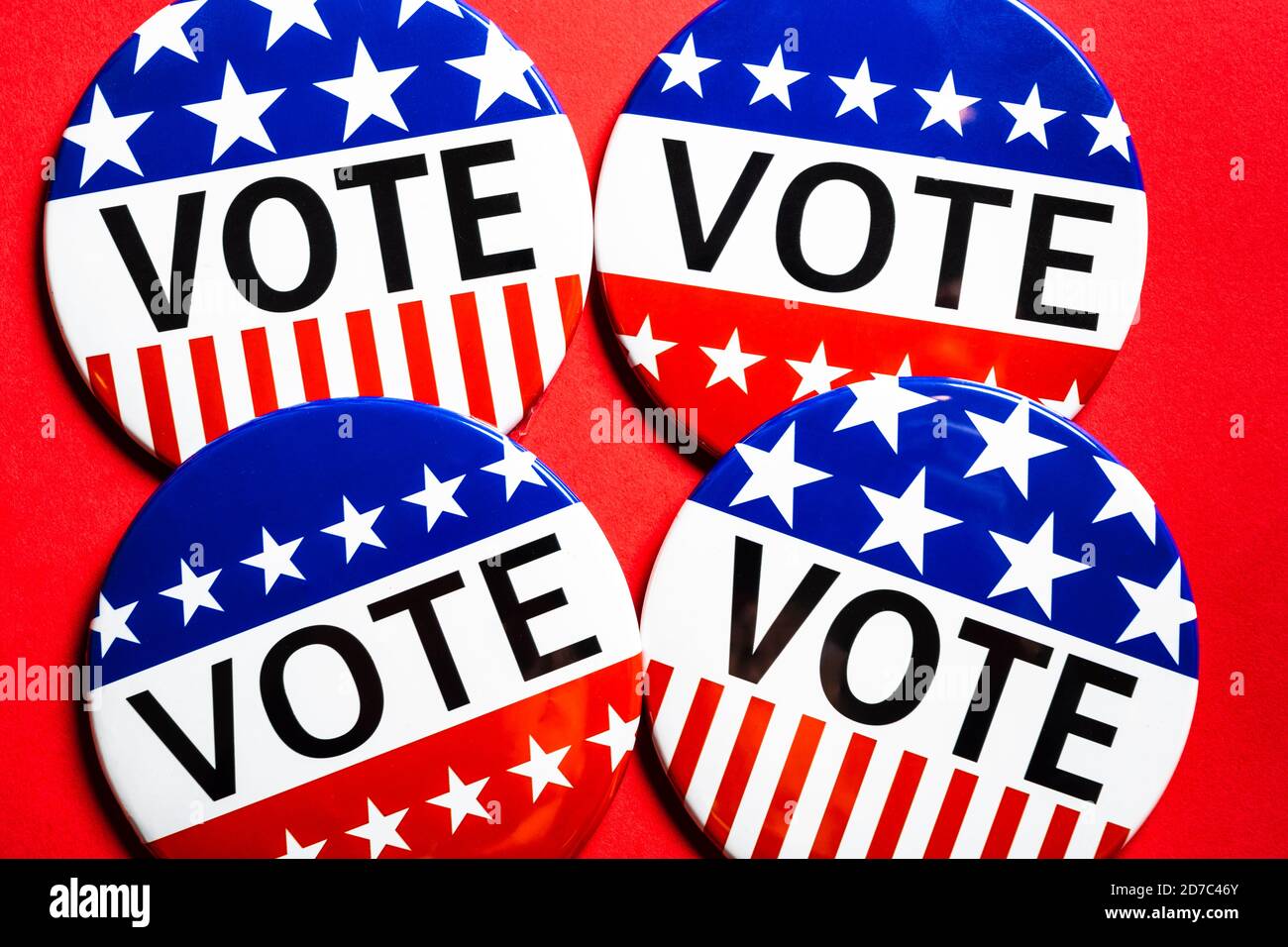 Vote buttons on red background with copy space. Election theme Stock Photo