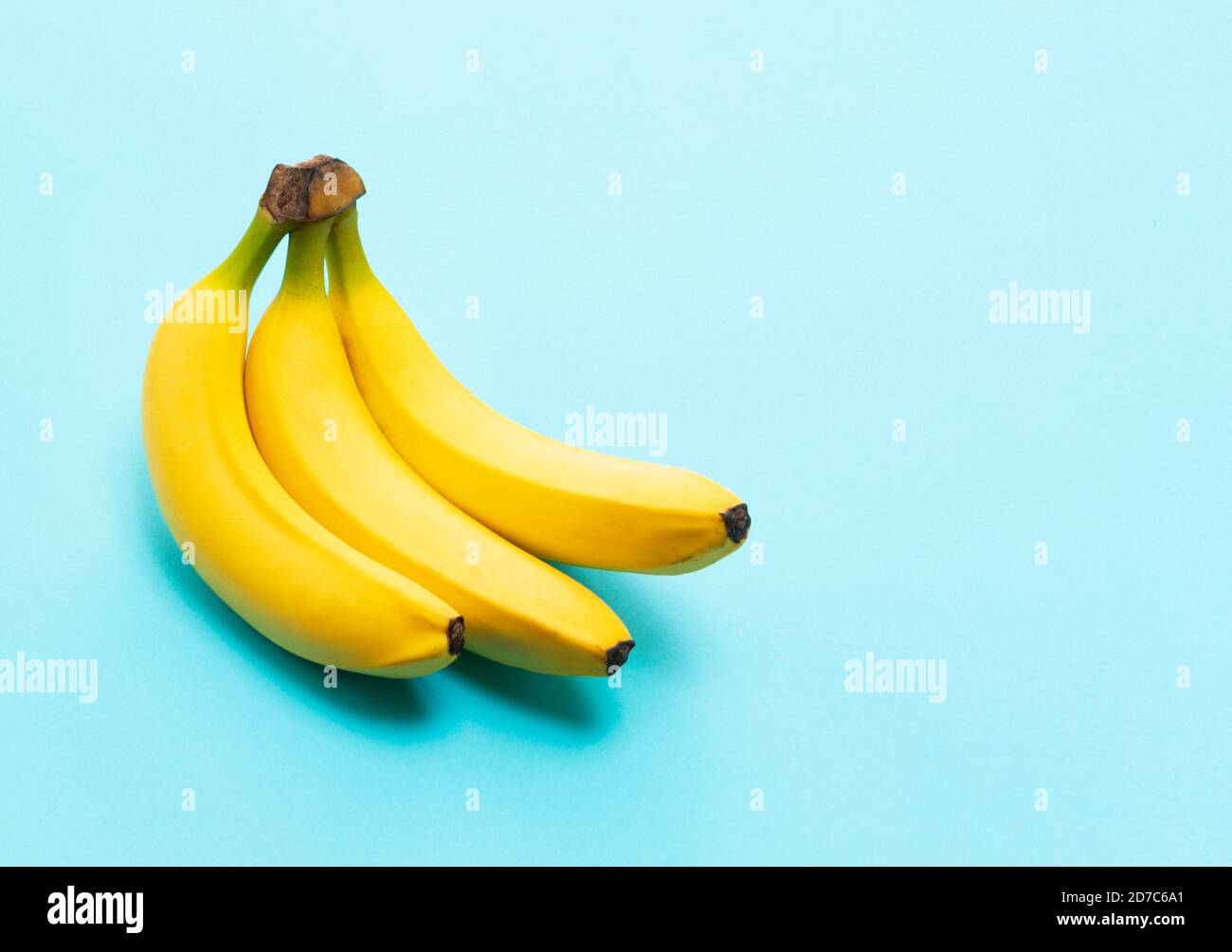 Bananas on a blue background with a copy space Stock Photo