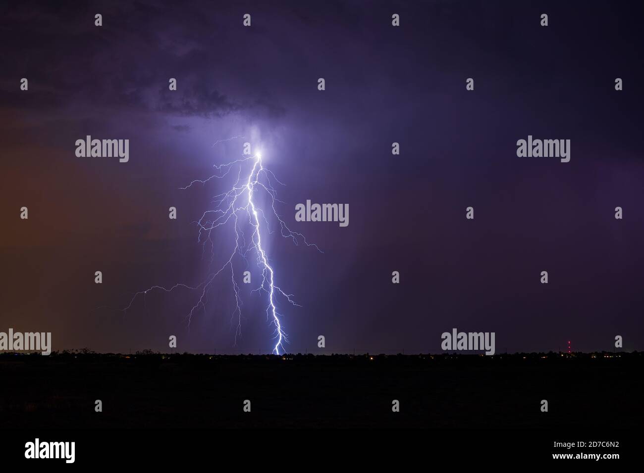 Dramatic thunderstorm lightning bolt strike from a storm in the night sky over Phoenix, Arizona Stock Photo