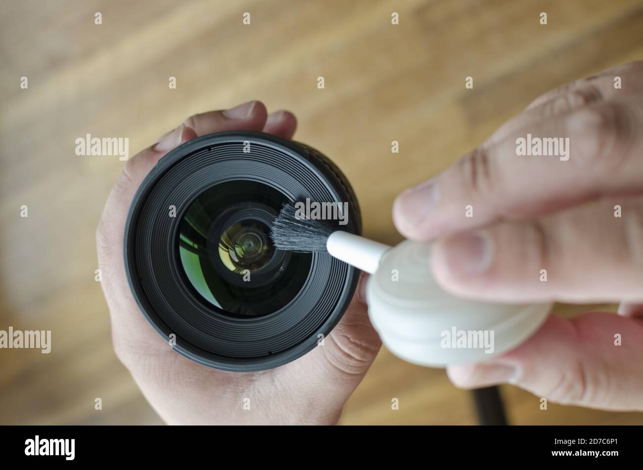 Top view of hands cleaning the lens Stock Photo - Alamy