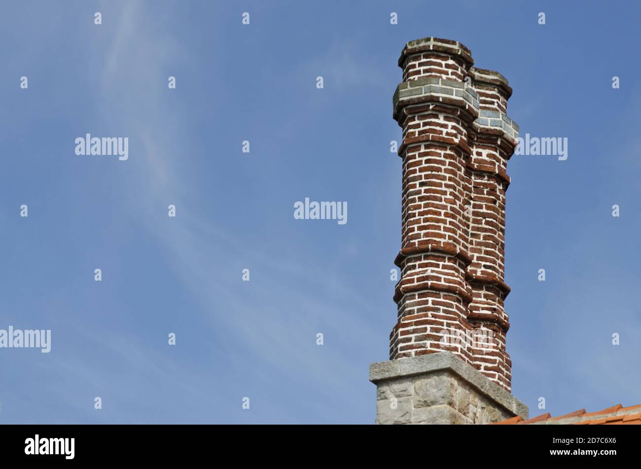 Low angle shot of brick chimney against a clear blue sky Stock Photo ...