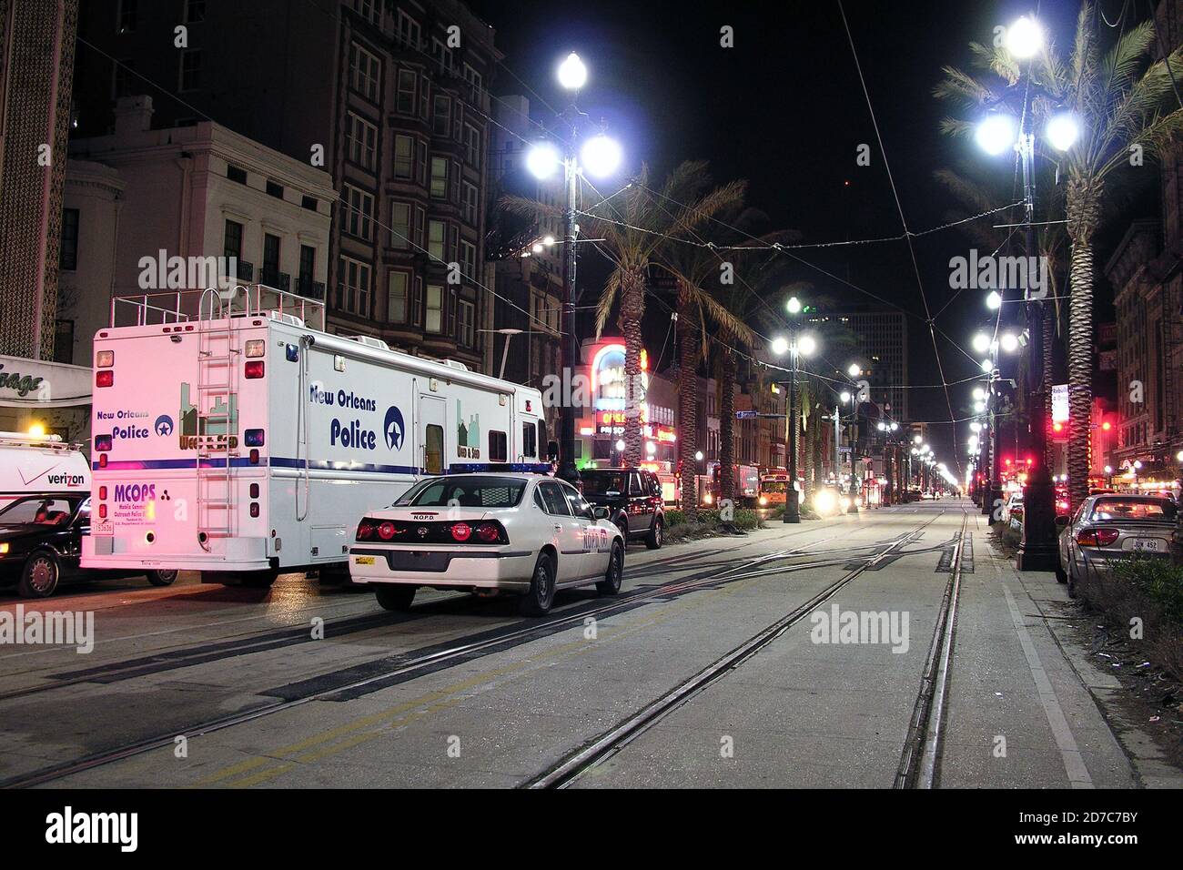 NEW ORLEANS, LOUISIANA, USA - DECEMBER 12, 2005:  Police vehicles stand watch on Canal Street. Stock Photo