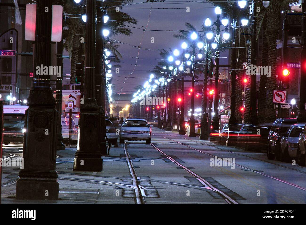 NEW ORLEANS LOUISIANA - DECEMBER 12, 2005:  Archival night view of police cars stand Canal Street near the historic French Quarter.. Stock Photo