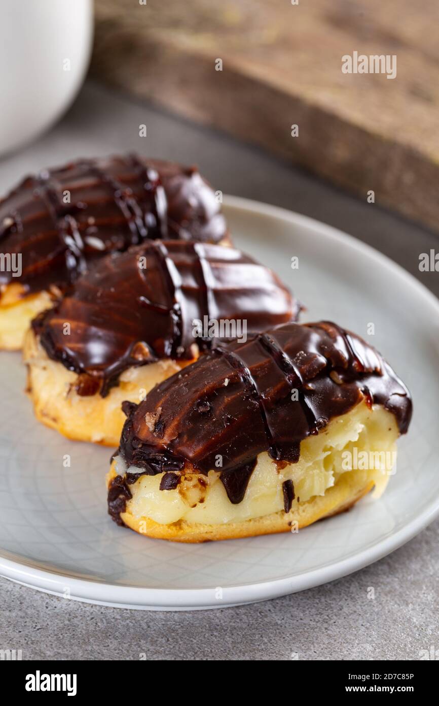 Traditional french eclairs with chocolate. Stock Photo