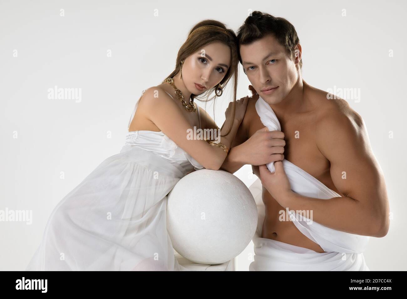 Romantic couple in antique outfits look at camera Stock Photo
