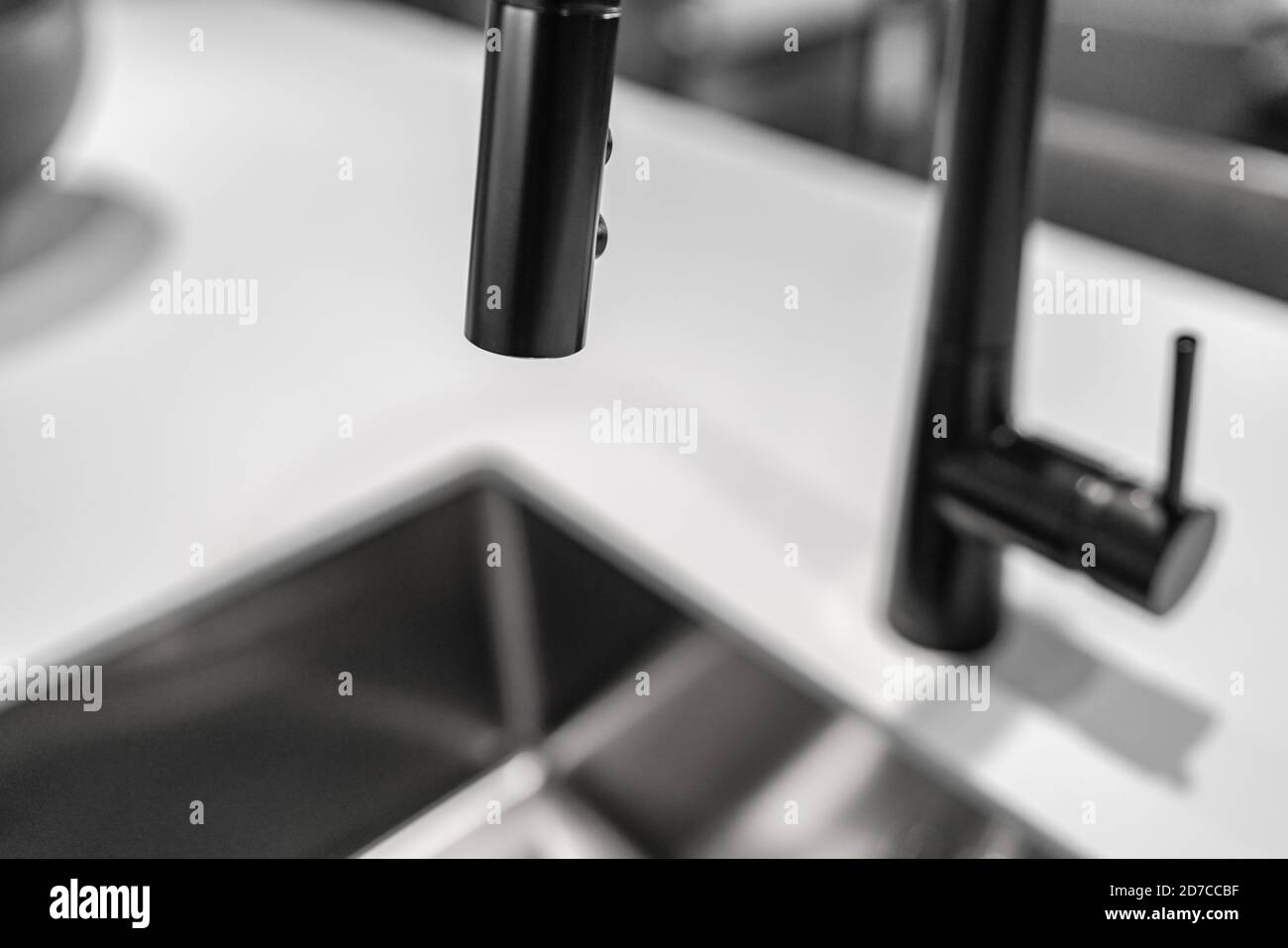 Black kitchen faucet over sink latest trend in interior design