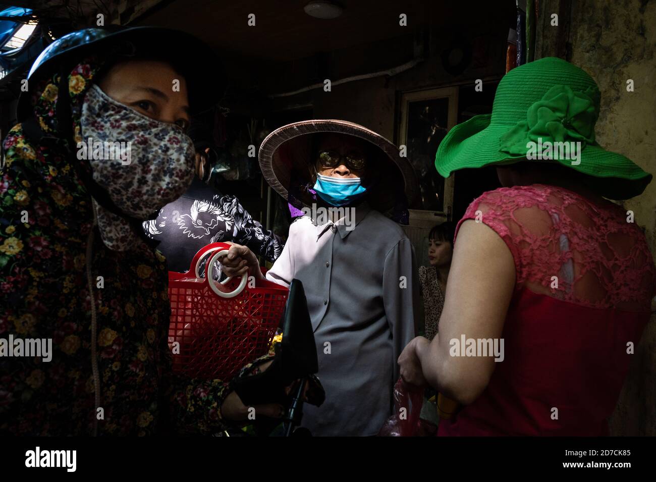 Vietnamese women with various types of headgear, Hanoi, Vietnam. 10 October 2020 Stock Photo