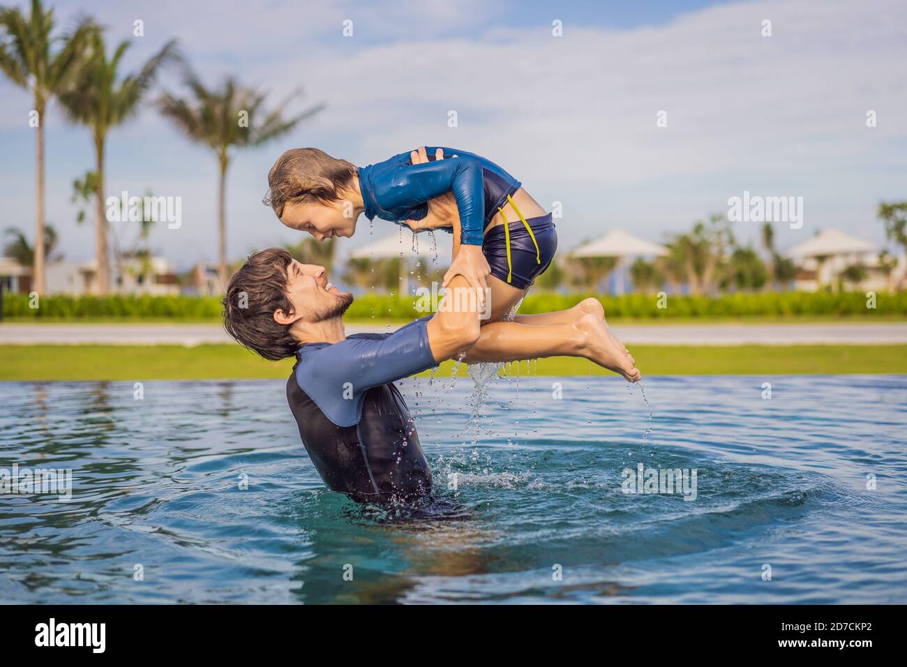 Father and Son having fun in the swimming pool Stock Photo - Alamy