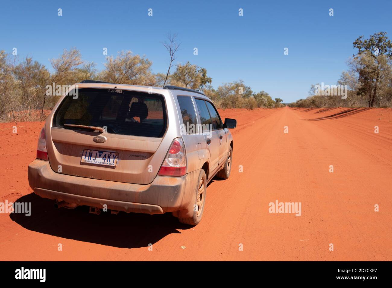 Vehicle on the road to Port Smith with well known red pindan colour of the south west Kimberley region. Stock Photo