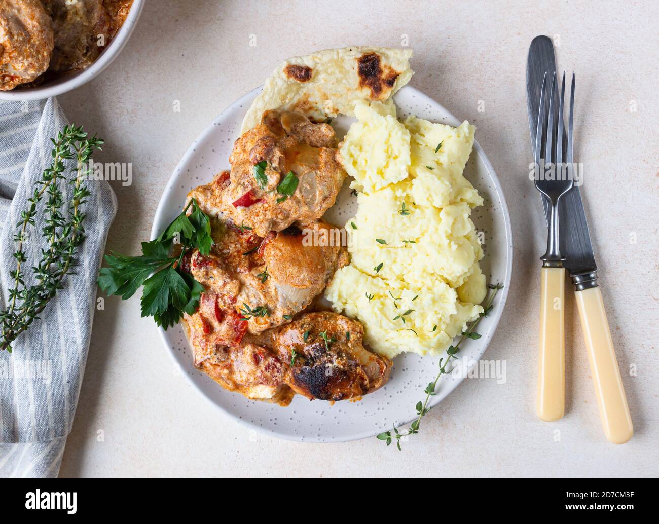 Chicken stew with sweet paprika and sour cream. Paprikash, traditional Hungarian dish. Balkanian cuisine. Autumn or winter comfort food. Stock Photo