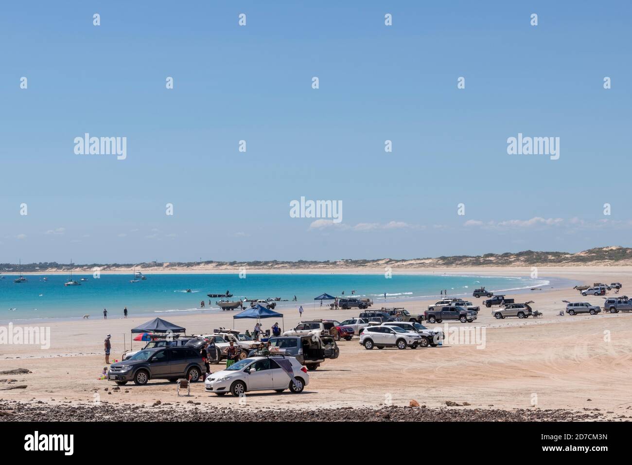 Vehicles and people on Broome's Cable Beach. Stock Photo