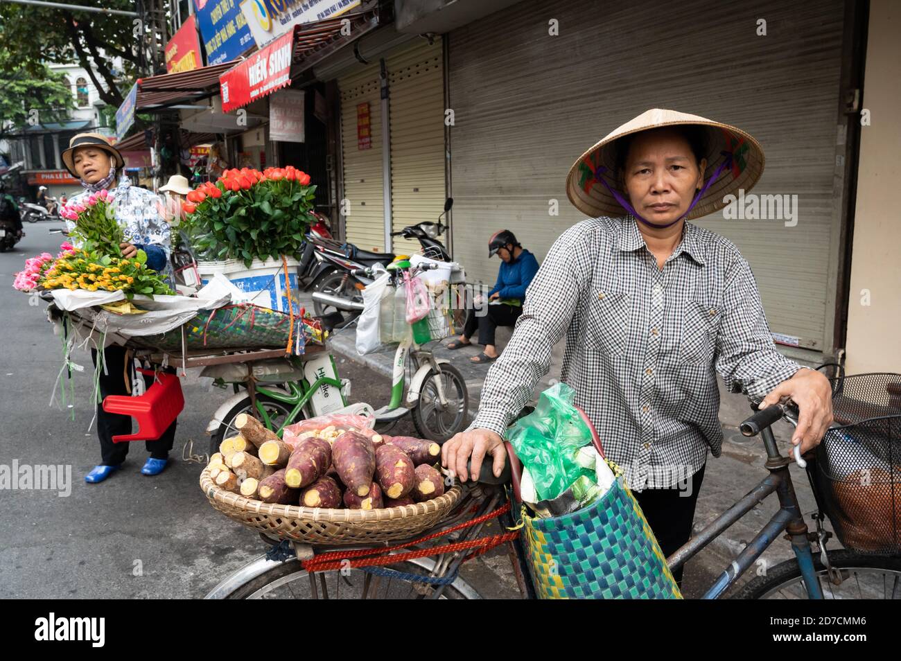 Portrait of a sweet potato vendor, Hanoi, Vietnam Stock Photo