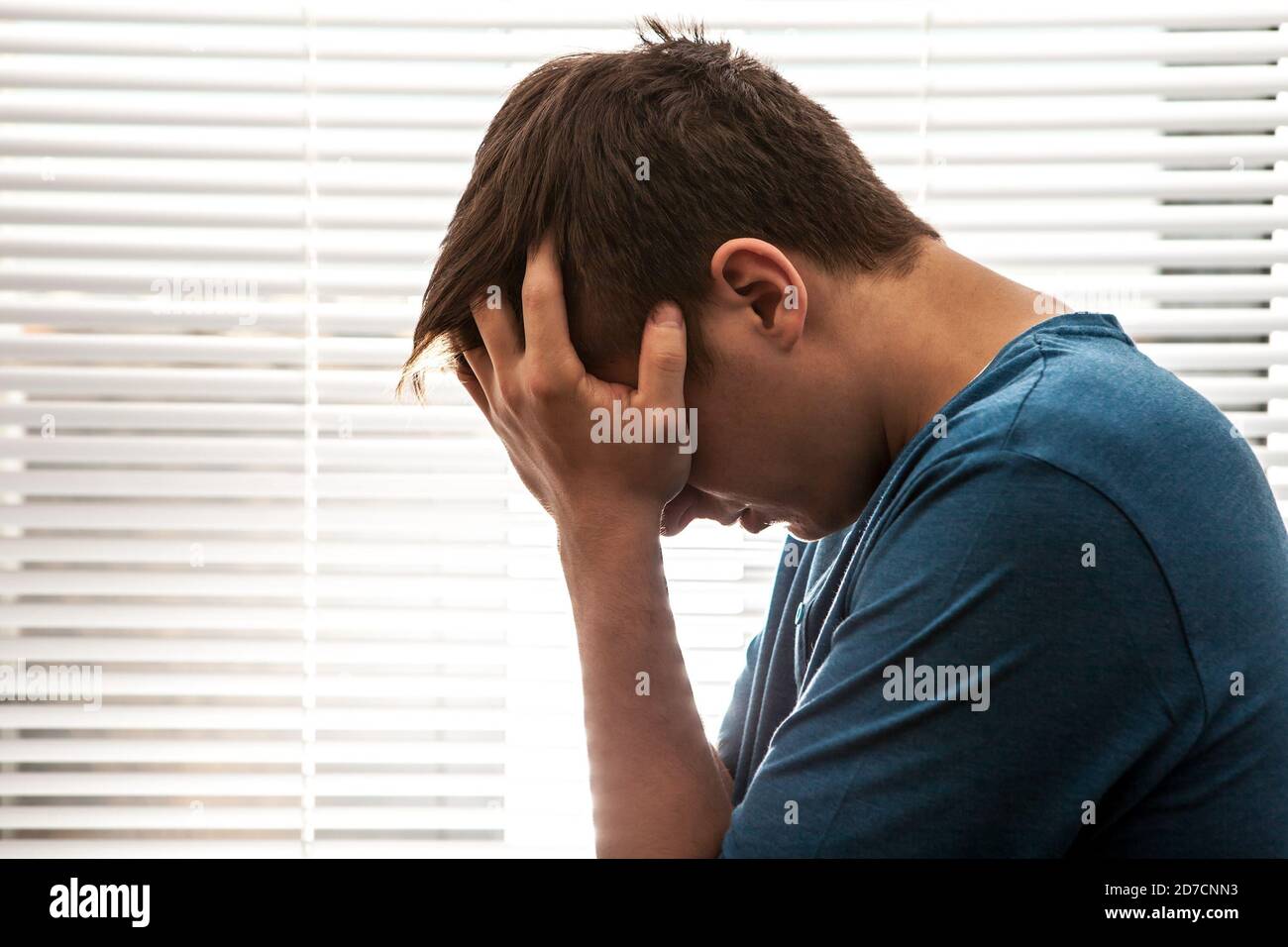 Sad young man silhouette hi-res stock photography and images - Alamy