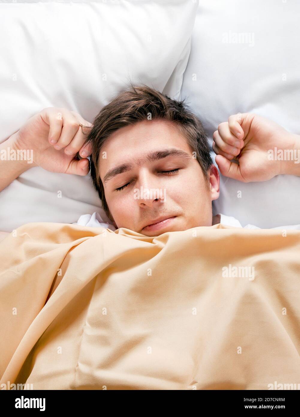 Young Man sleep in the Bed at the Home Stock Photo