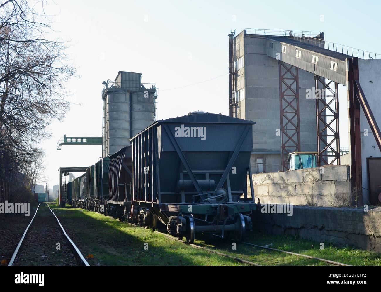 Railroad cars at cement manufacturing plant. Readymix and building