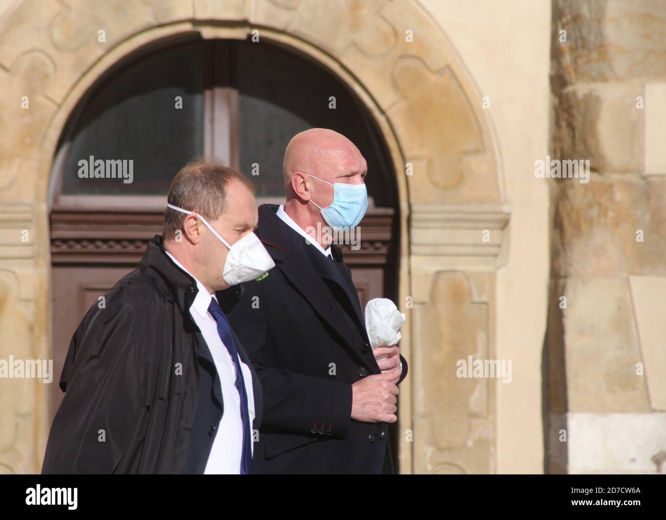 Cracow. Krakow. Poland. Second wave of coronavirus pandemic. Restrictions are back. Two men wearing masks. Stock Photo