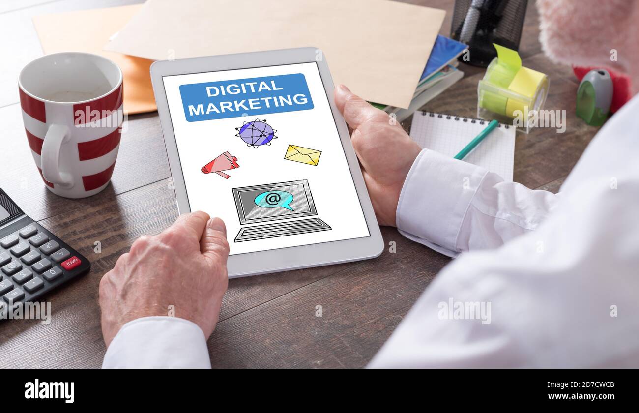 Digital marketing concept shown on a tablet held by a man Stock Photo ...