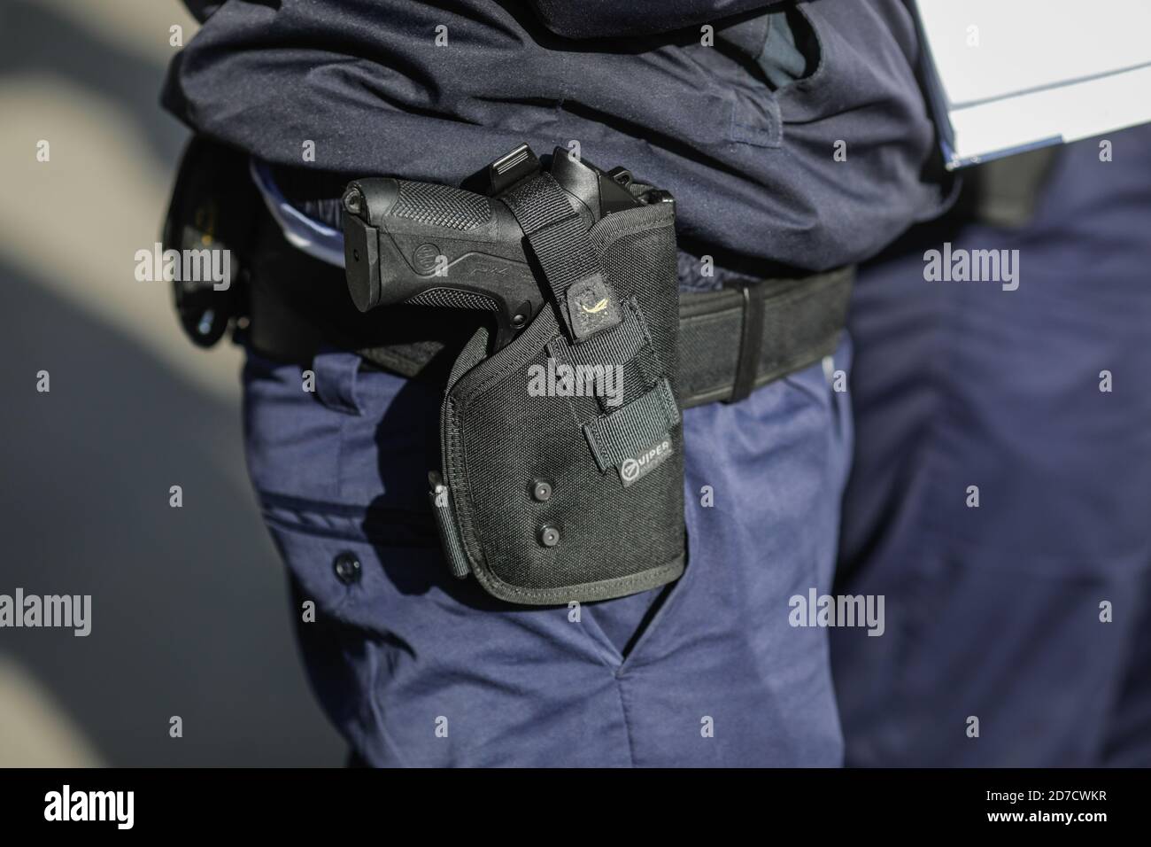 Bucharest, Romania - October 21, 2020: Details with a Beretta PX4 gun in the holster of a police officer. Stock Photo