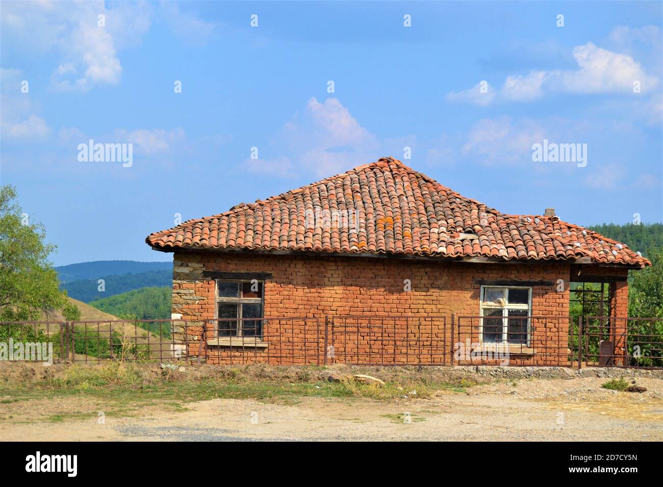 Old and traditional house in a bulgarian village made of red bricks and ...