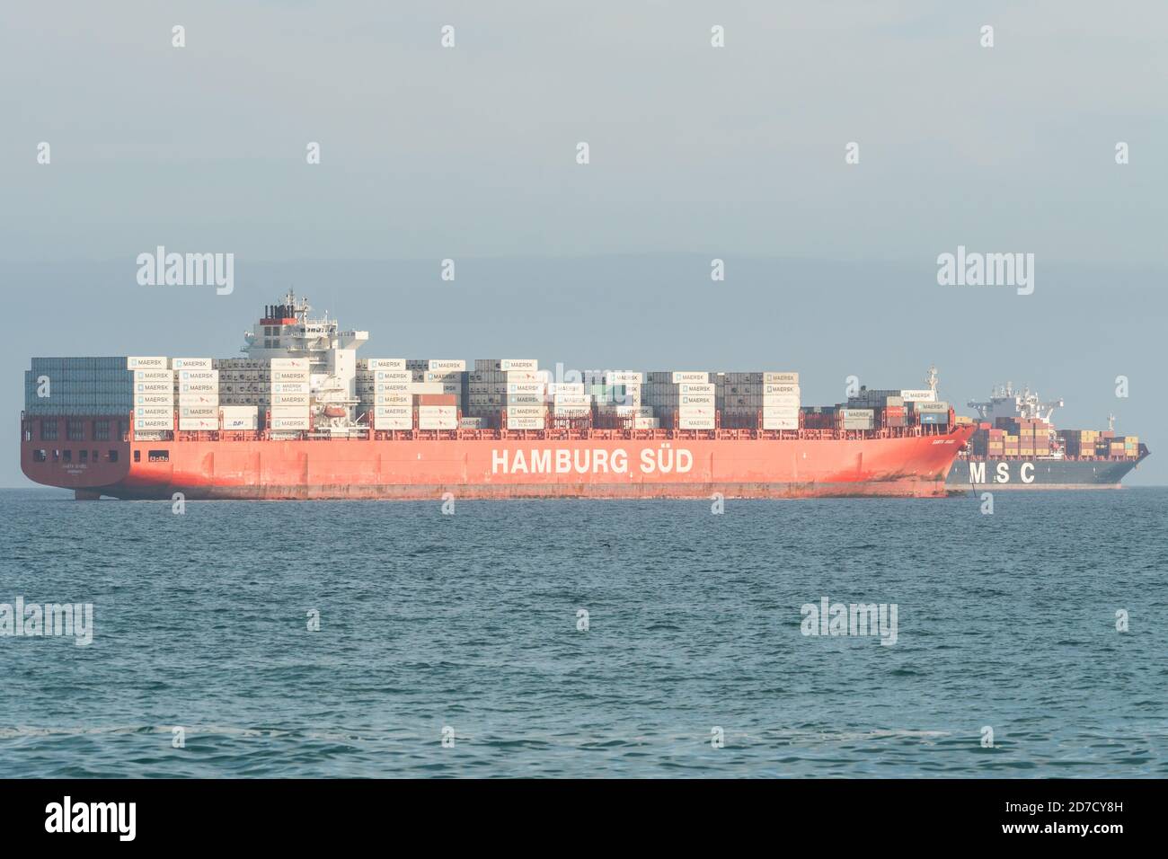 Hamburg Süd container ship loaded with freight or cargo anchored in Table Bay, Cape Town, South