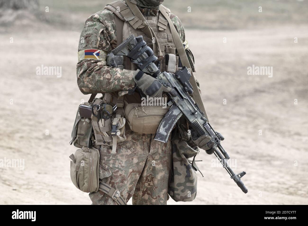 Soldier with assault rifle and flag of Artsakh and also known as Nagorno-Karabakh Republic. Collage. Stock Photo