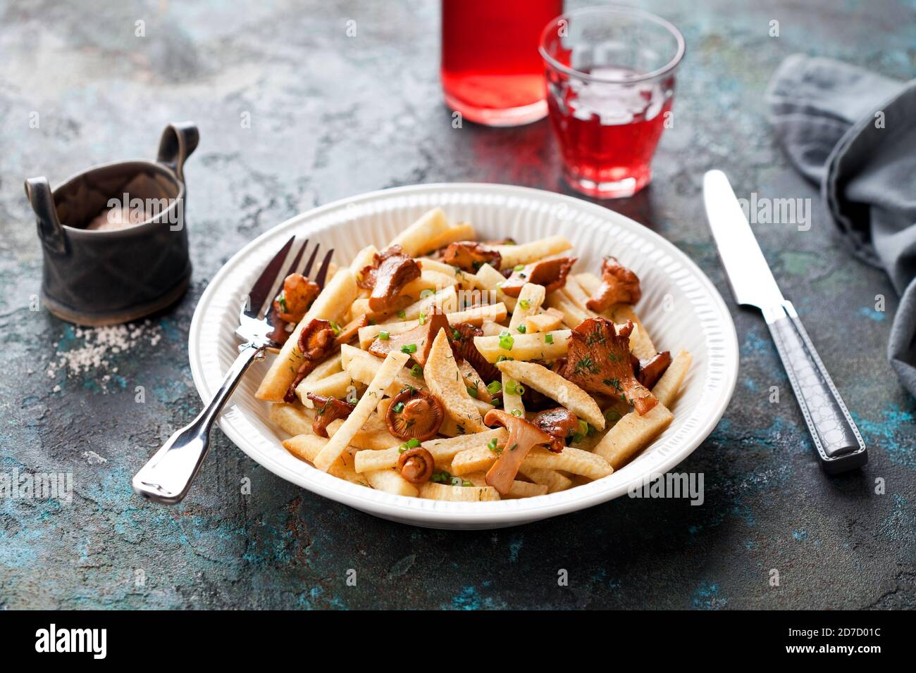 Fried yam with chanterelle mushrooms, selective focus Stock Photo